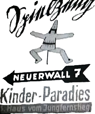 Werbetafel mit Kinderparadies-Reklame.